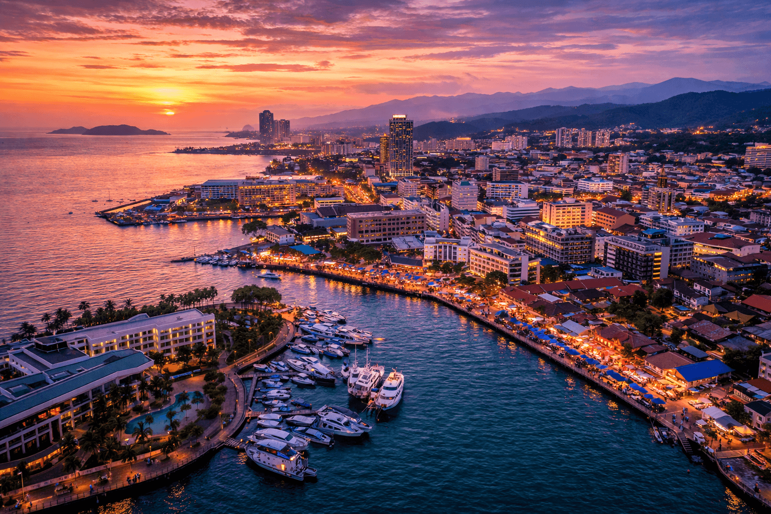 Kota Kinabalu waterfront and city skyline at sunset with marina and coastal views in Sabah, Malaysia