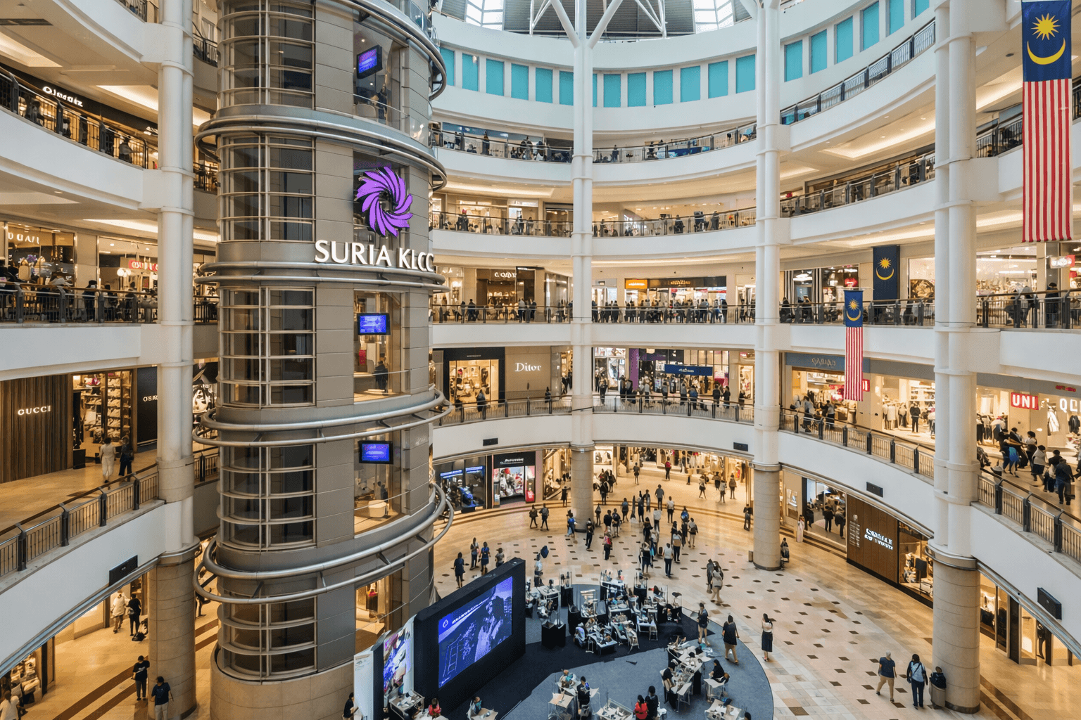 Interior of Suria KLCC shopping mall in Kuala Lumpur with multiple retail levels