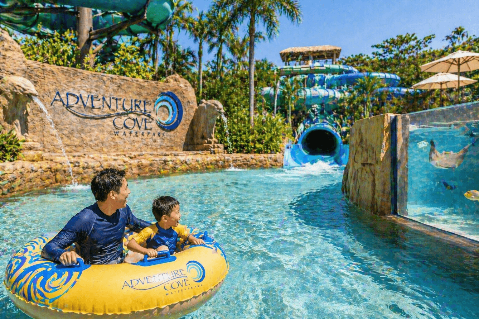 Family enjoying Adventure Cove Waterpark in Sentosa Singapore with lazy river and water slides.